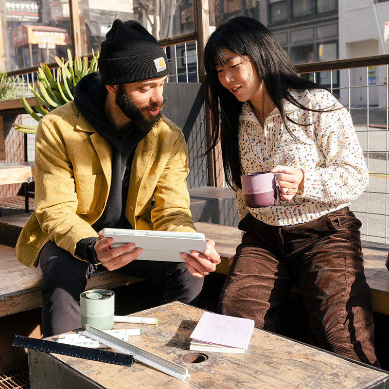 12oz-rise-mug-a4 12oz_rise_coffee_mug_dusty_orchid_couple_city_patio_square.jpg