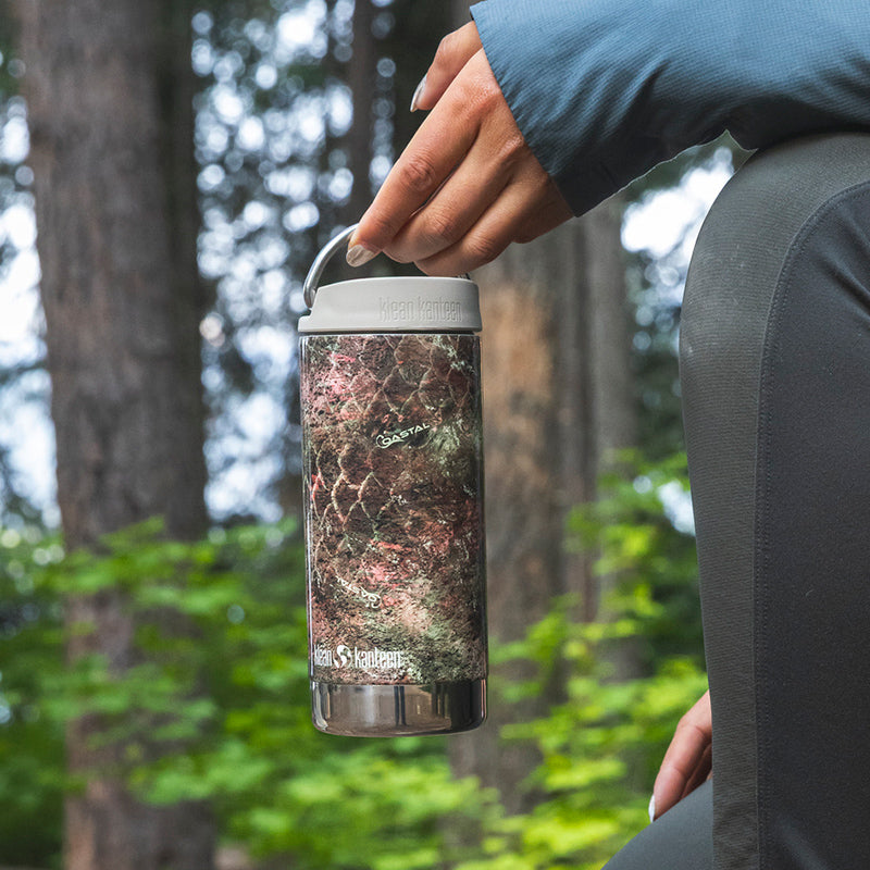 12oz-tkwide-with-twist-cap-mossy-oak-h2 12oz_tumbler_mossyoak_rainbowtrout_hand_closeup_square.jpg