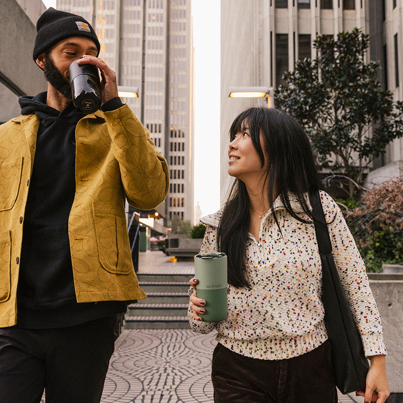 16oz-rise-tumbler-z7 16oz_rise_tumbler_black_iceberg_couple_drink_city_street_square.jpg