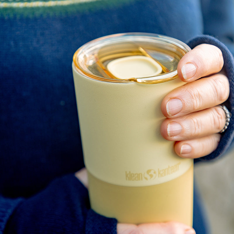 daily-on-the-go-set-w4 16oz_rise_tumbler_wax_yellow_closeup_hand_lid_square.jpg