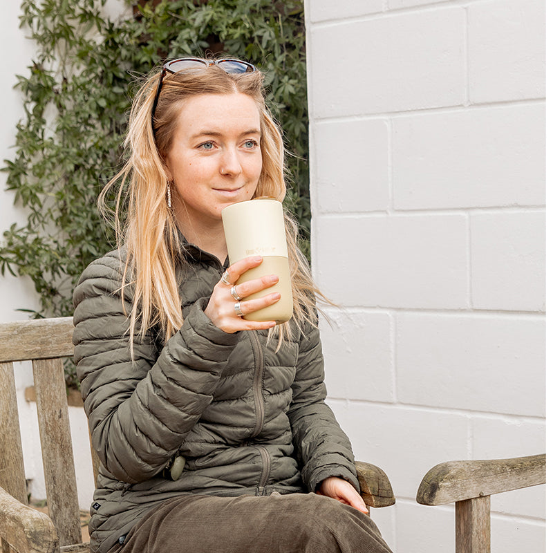 16oz-rise-tumbler-z7 16oz_rise_tumbler_wax_yellow_woman_seat_outside_square.jpg