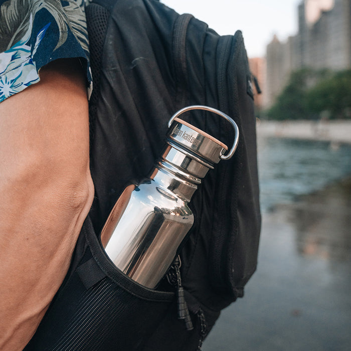 27oz-reflect-with-bamboo-cap-t7 K27SSLRF-MS-BAMBOO_reflect-bottle_backpack_lifestyle.jpg